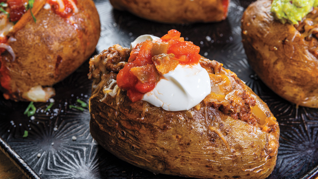 Air Fryer Loaded-Taco Baked Potatoes with Guacamole