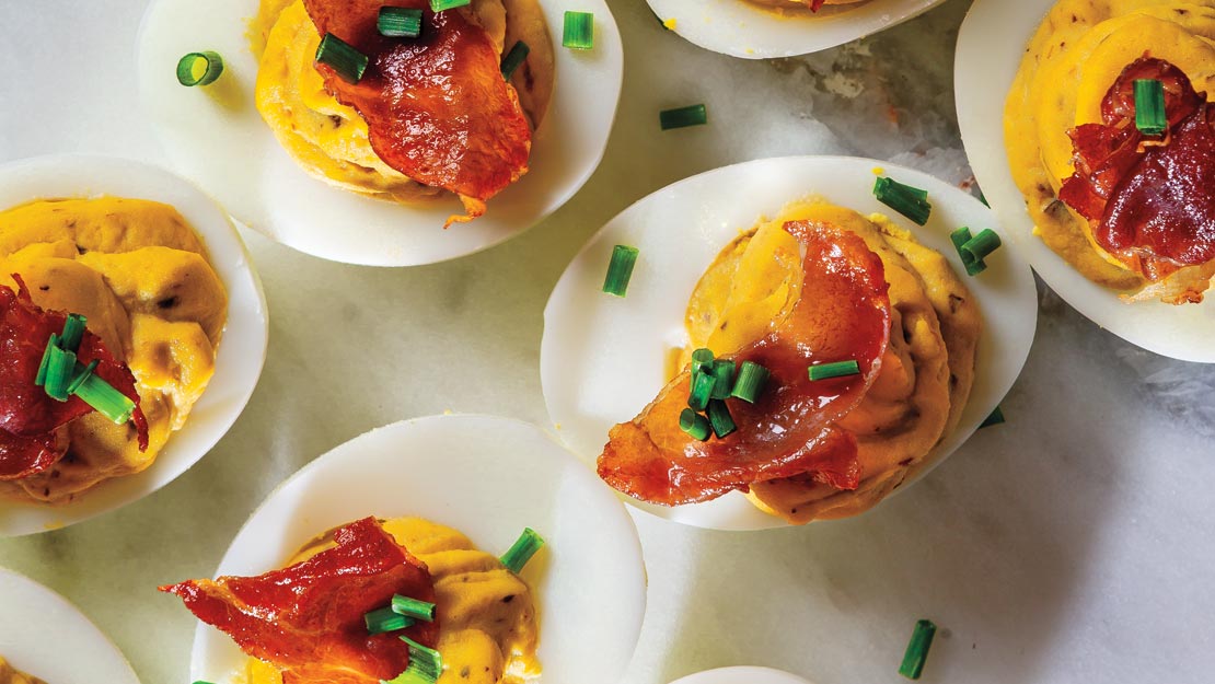 Olive Tapenade Hummus Deviled Eggs with Crispy Prosciutto 