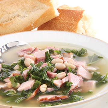 White Bean and Kale Soup with Handcrafted Ham Off the Bone