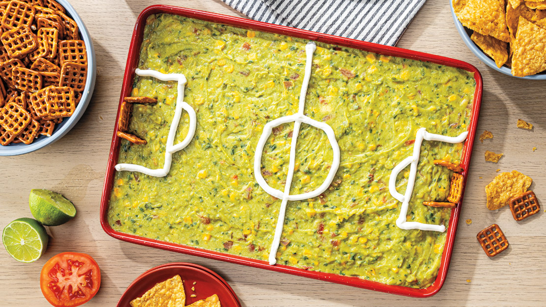 Soccer Field Guacamole with Corn & Tomato