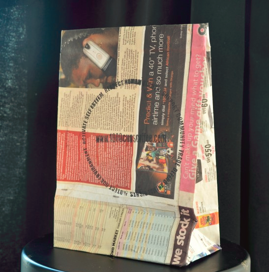 popped corn in newspaper bags