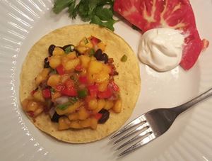 peach salsa on a tortilla